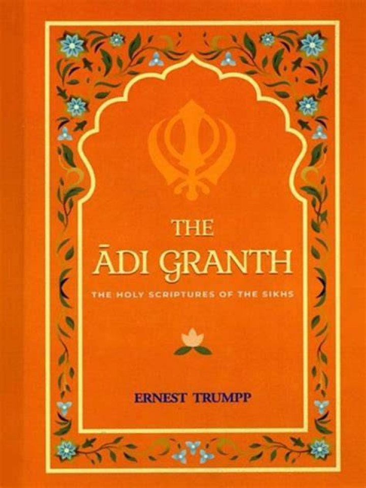 Who scribed adi granth in 1604?